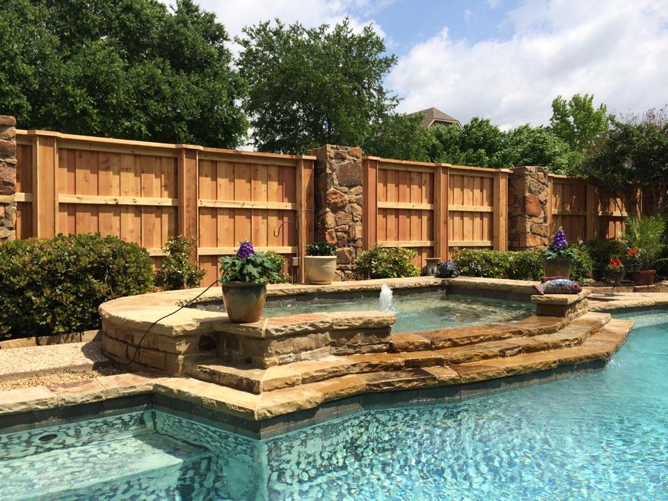 Hancock Fence residential fencing in scenic backyard with pool